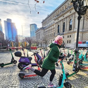 Woman with electric scooter